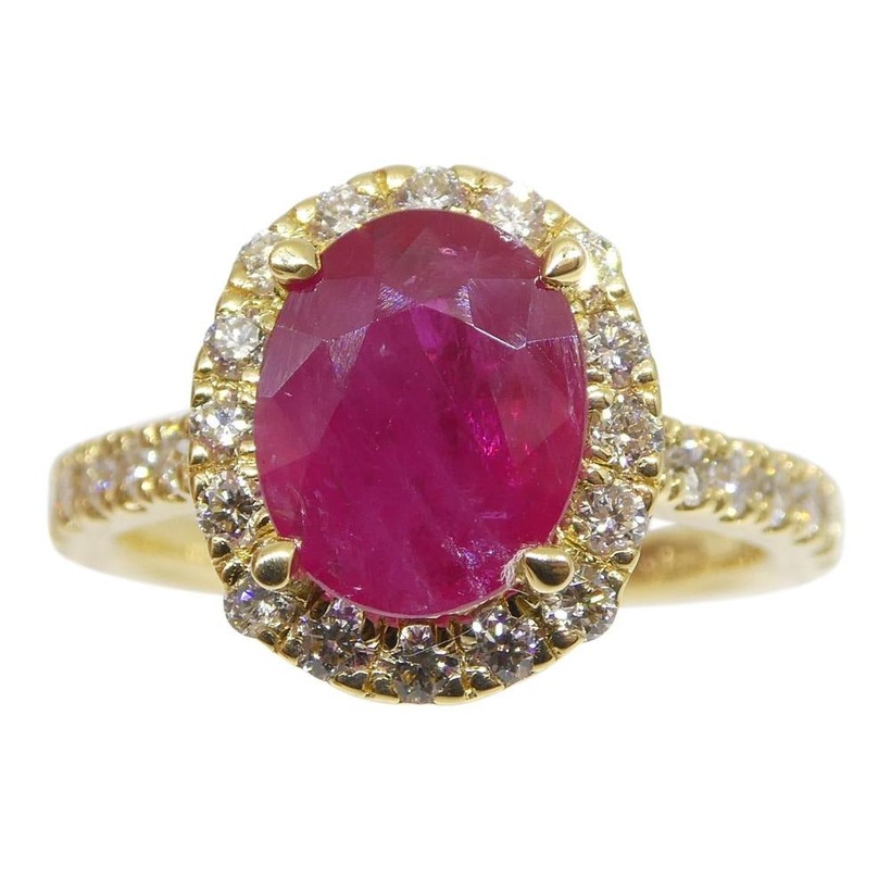 Mozambique ruby and diamond halo ring